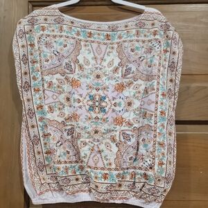 medium ladies sleeveless top with gathered waist with tie on side.